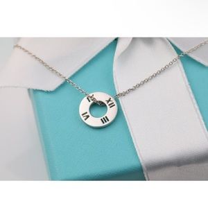 Tiffany & Co. Atlas Roman Numeral Round Circle
Pendant Necklace